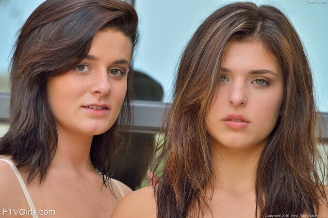 Girlfriends in tank tops walk the streets stripping down and kissing