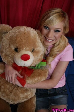 Teen Sascha Sin gets naked and poses naked on the bed with her teddy bear