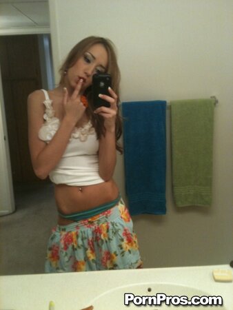 Slutty Victoria pulls up her top and takes nude selfies in the bathroom