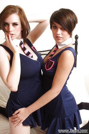 Steamy babes in dark-blue dresses expose their natural breasts and kiss the lips