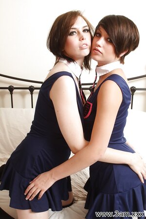 Steamy babes in dark-blue dresses expose their natural breasts and kiss the lips