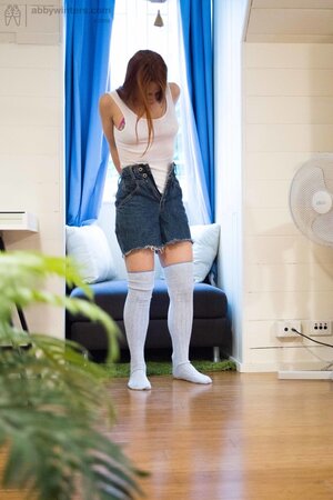 Girl in high socks puts on clothes without knowing that a roommate spies on her