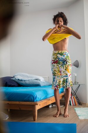 Tall Adriana E covers her skinny body with a multicolor skirt and top