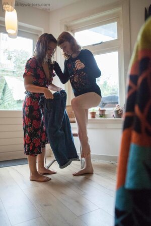 After morning sex tanned lesbian with natural tits helps her friend to get ready