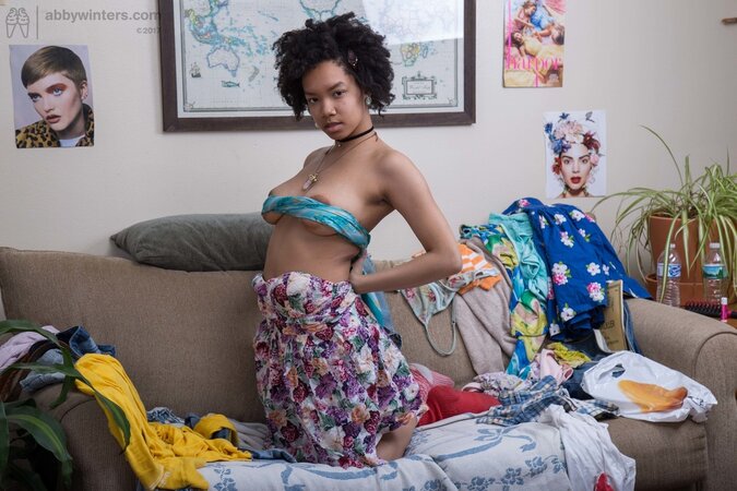 Black babe wearing different socks is obliged to expose boobs with big nipples