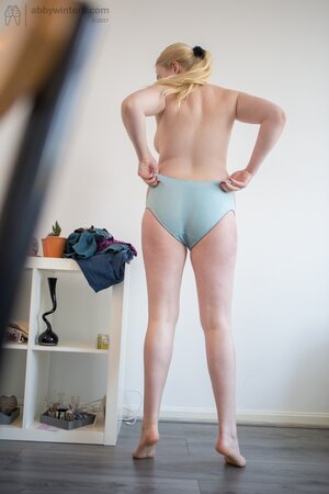 Unknowingly plump blonde chick takes part in XXX shooting while getting dressed