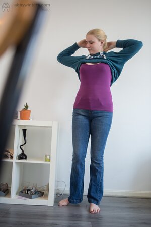 Unknowingly plump blonde chick takes part in XXX shooting while getting dressed