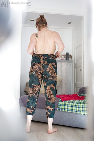 Pale-skinned babe flaunts her body and quickly gets fully dressed on hidden camera