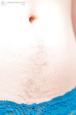 Nerdy redhead with bangs and pale skin proudly presents hairy pussy pics