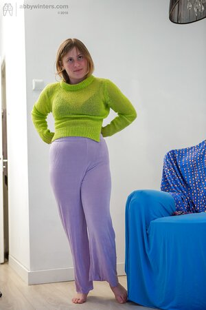 Amateur girl Juliana with big tits puts on her purple pants after showering