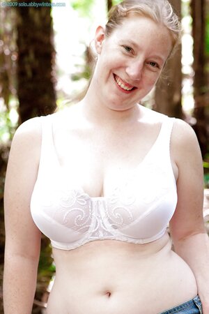 Plump female walks in a forest and exposes saggy boobs and shaved cunt