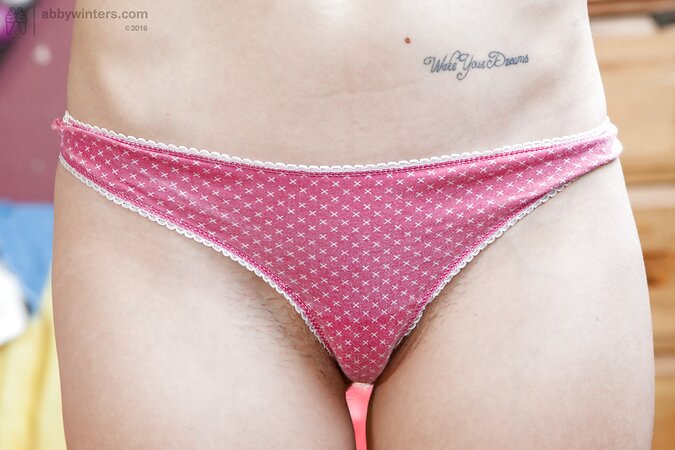 Young Poppy takes off her cute slips and bra to take some nude pictures