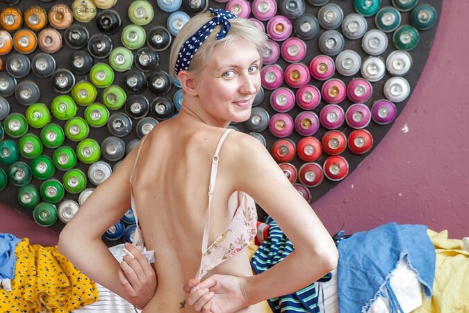 Young Poppy takes off her cute slips and bra to take some nude pictures