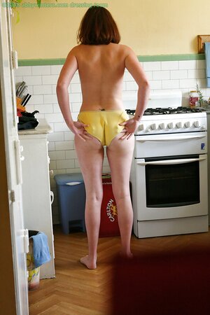 Whorey gets dressed in the kitchen being filmed on a hidden camera