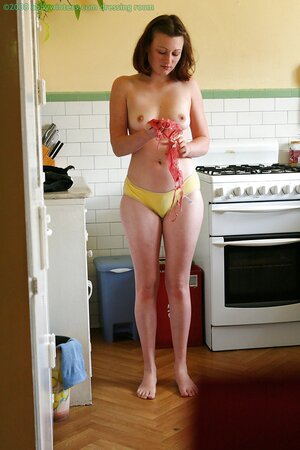 Whorey gets dressed in the kitchen being filmed on a hidden camera