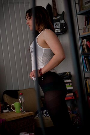 Young Bea pulling up green panties and tights after posing naked