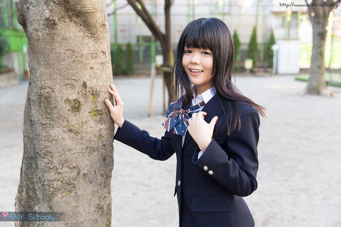Young Japanese girl gets naked looking into the camera with her eyes full of lust