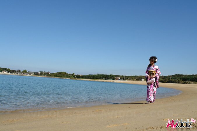 Asian slut knows her business and walks down the ocean shore attracting boys