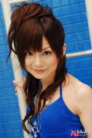 Skinny Japanese teen poses on cam somewhere in private swimming pool