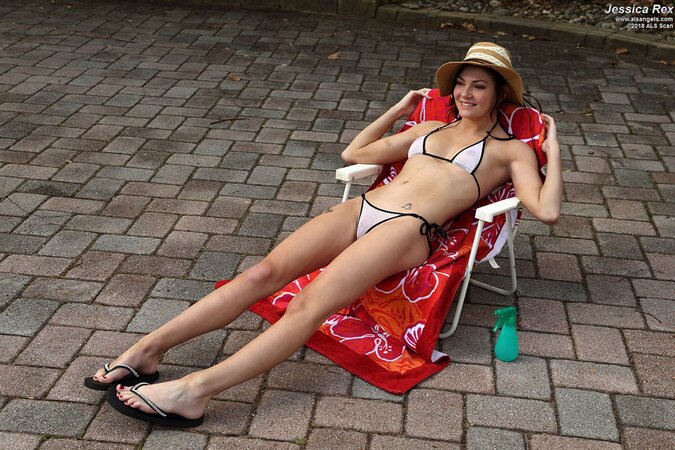 Dark-haired girl is in a good mood but vacuum pump makes it even better