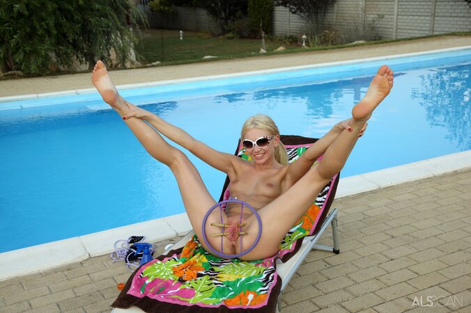 Petite blonde Cayenne undresses outdoors and gets visited by her GF with a toy