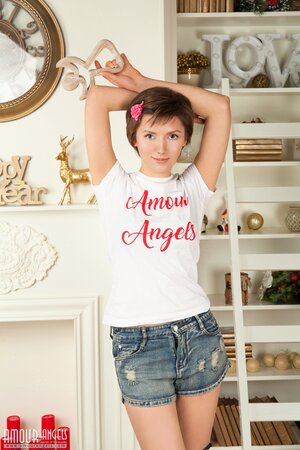 Love with a flower in her hair makes broad her sexuality on a soft carpet