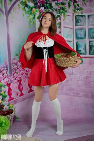 Little Red Riding Hood gets back to basics wearing a simple birthday suit