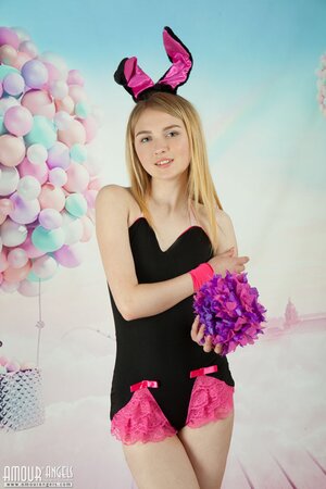 Freshly young teen with naughty bunny ears strips naked in the studio