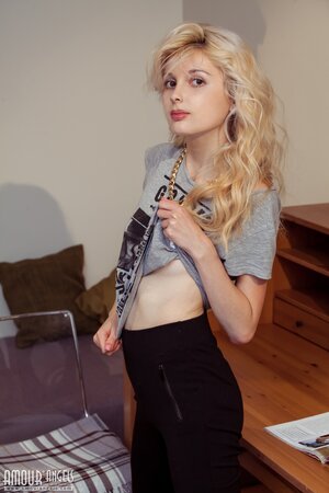After bathroom naughty blonde doesn't mind stripping naked for a photographer