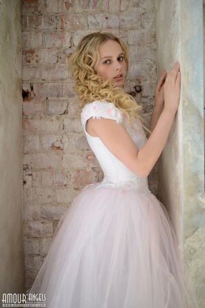 Before wedding ceremony enticing blonde performs strip show in abandoned chapel
