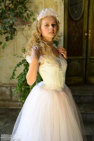 Before wedding ceremony enticing blonde performs strip show in abandoned chapel