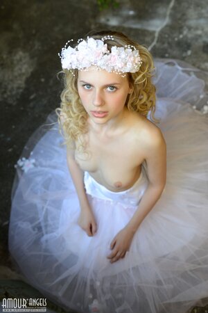 Before wedding ceremony enticing blonde performs strip show in abandoned chapel