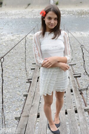 Adorable gal Nensi not shy to pose without clothes on a suspension bridge
