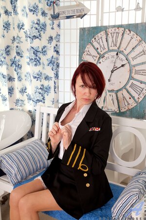 After a flight mature stewardess Scarlet Rose relaxes naked in her apartment