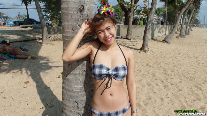 Thai babes rest on a beach and pose in tight bikini flashing innie navels