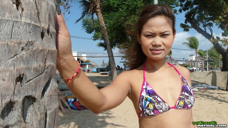 Thai babes rest on a beach and pose in tight bikini flashing innie navels