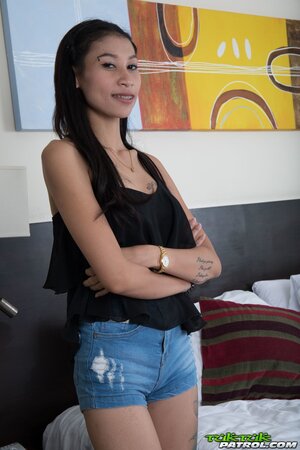 Eastern babe in jean shorts performs fellatio before being carnal in bed