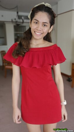 Thai slut in a red dress never stops smiling even in the backseat of a taxi
