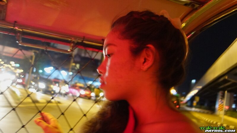 Thai slut in a red dress never stops smiling even in the backseat of a taxi
