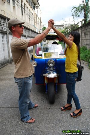 Naughty Eastern girl in yellow T-shirt and jeans finds a guy who pays for posing