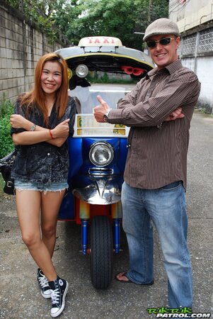 Clothed Thai girl with a cute face and red hair can brag about wonderful legs
