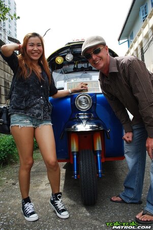 Clothed Thai girl with a cute face and red hair can brag about wonderful legs