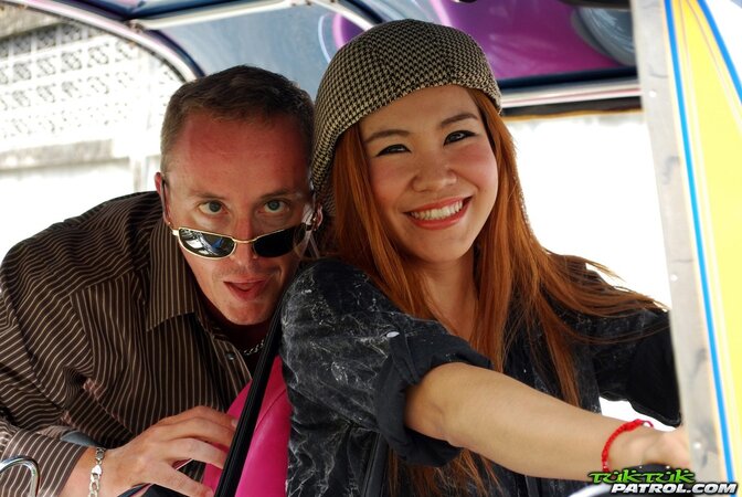 Clothed Thai girl with a cute face and red hair can brag about wonderful legs