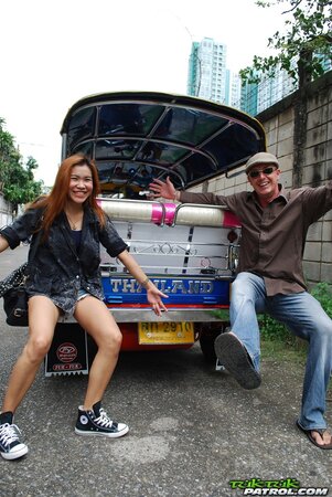 Clothed Thai girl with a cute face and red hair can brag about wonderful legs