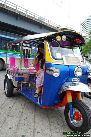 Asian teen Tukta with red hair wears sexy violet dress and prefers Tuk Tuk taxi
