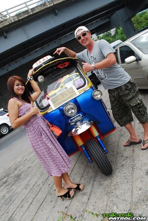 Asian teen Tukta with red hair wears sexy violet dress and prefers Tuk Tuk taxi