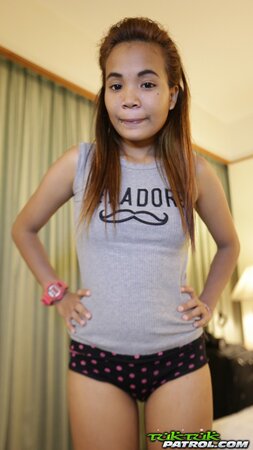 Teen Asian girl looks very cute despite the fact that she wears braces