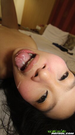 Obedient Asian cutie facialized after sex in the hotel room with tourist