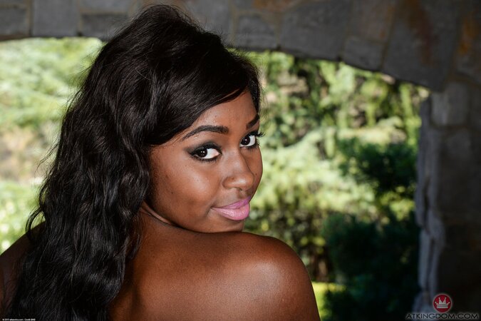 Black babe Camille Amore in an obscene top flaunts her breasts and cunt