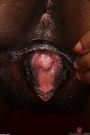 Babe with chocolate skin wears milky-white lingerie and shows pink pussy